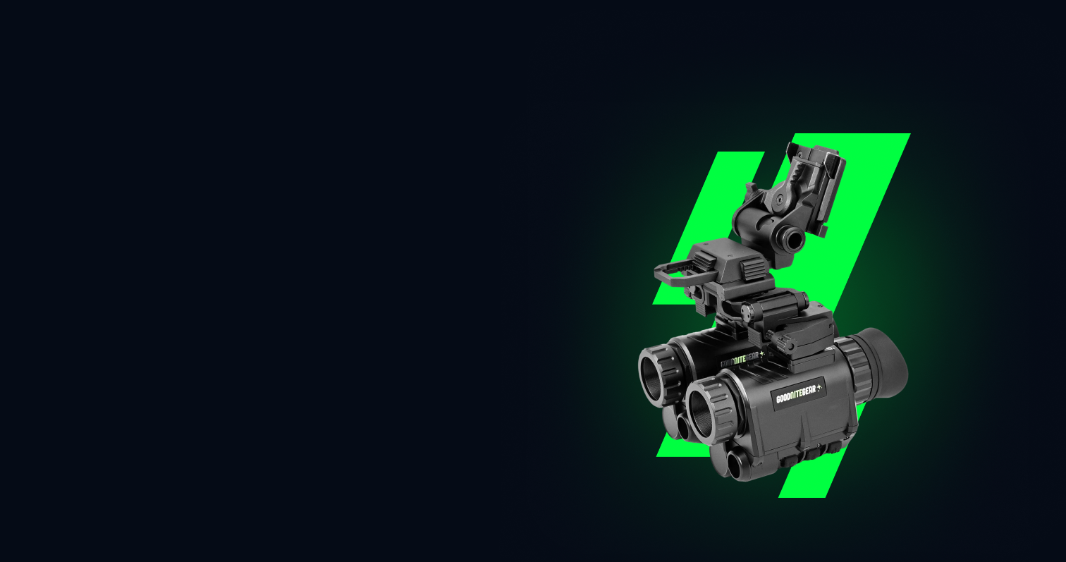 Black tactical device with green accents on a black background