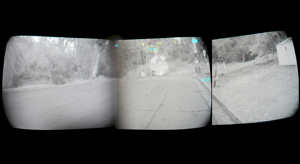A quad pano nvg night-vision outdoor scene showing a road or driveway bordered by trees and a building, with a blurred central area obscuring part of the scene and an ir laser and illuminator.
